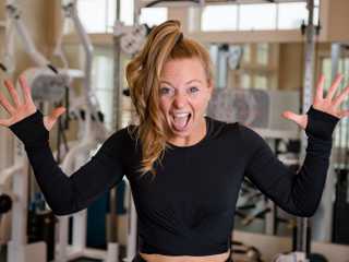 Kristie ecstatic in a gym setting